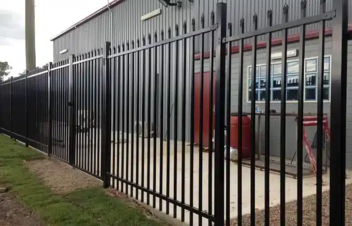 Crimped Spear Security Fencing installed outside a warehouse
