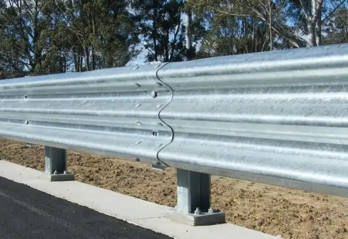 BIKER SHIELD guardrail system with silver finish installed on road