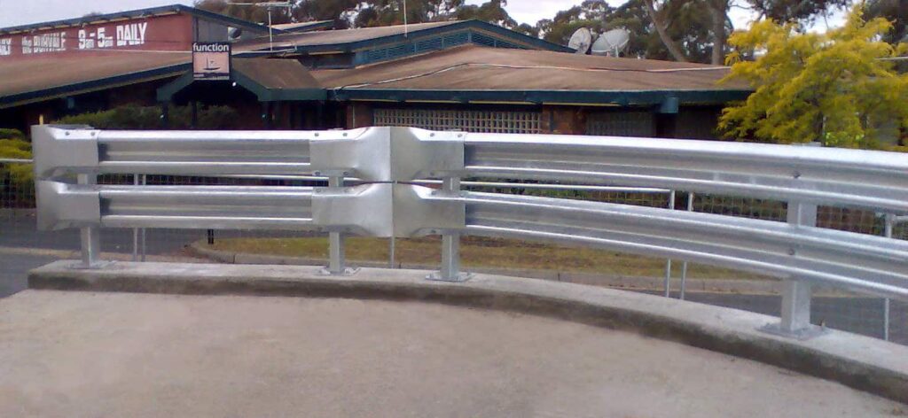 ARMCO guardrail installation near retail stores