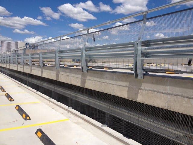Steel Fence and barrier with parking stops and yellow lines in Hurlstone Park RSL car park