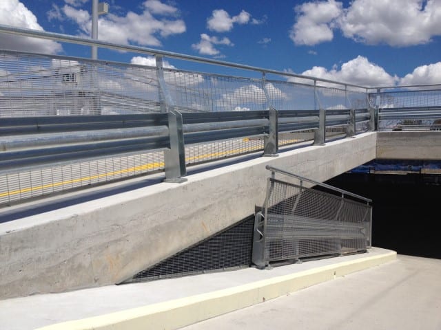 Entry into underground car park of Hurlstone Park RSL Club near parking barriers, guard rails and fences