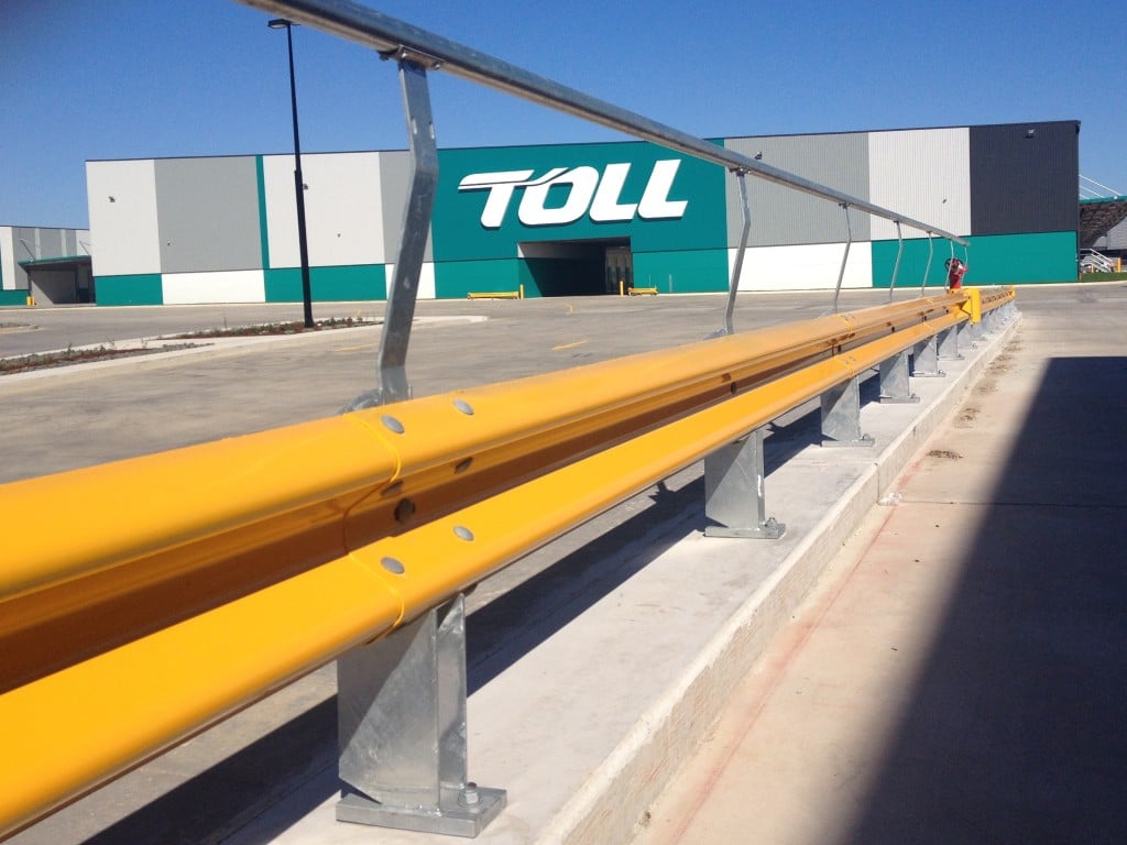 Car park yellow barrier installation at Toll warehouse