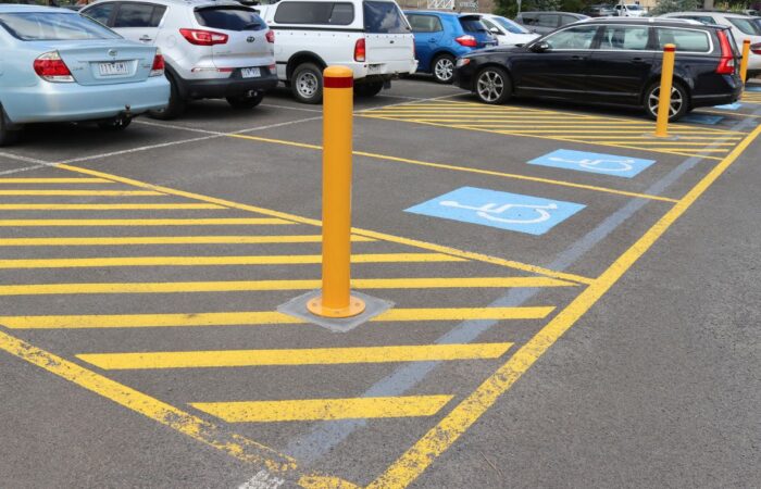 Base Plated Bollards installed near disabled parking spaces