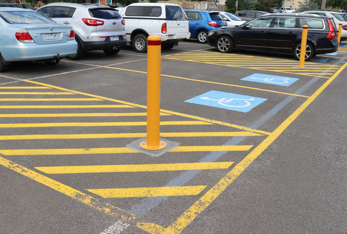 Base Plated Bollards installed near disabled parking spaces