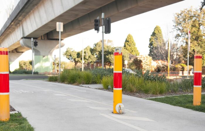 Lock in Bollards installed on cycling path near road