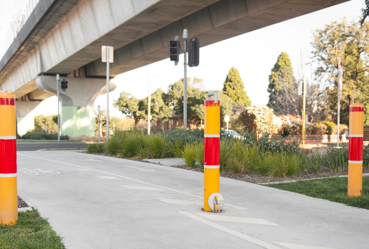 Lock in Bollards installed on cycling path near road