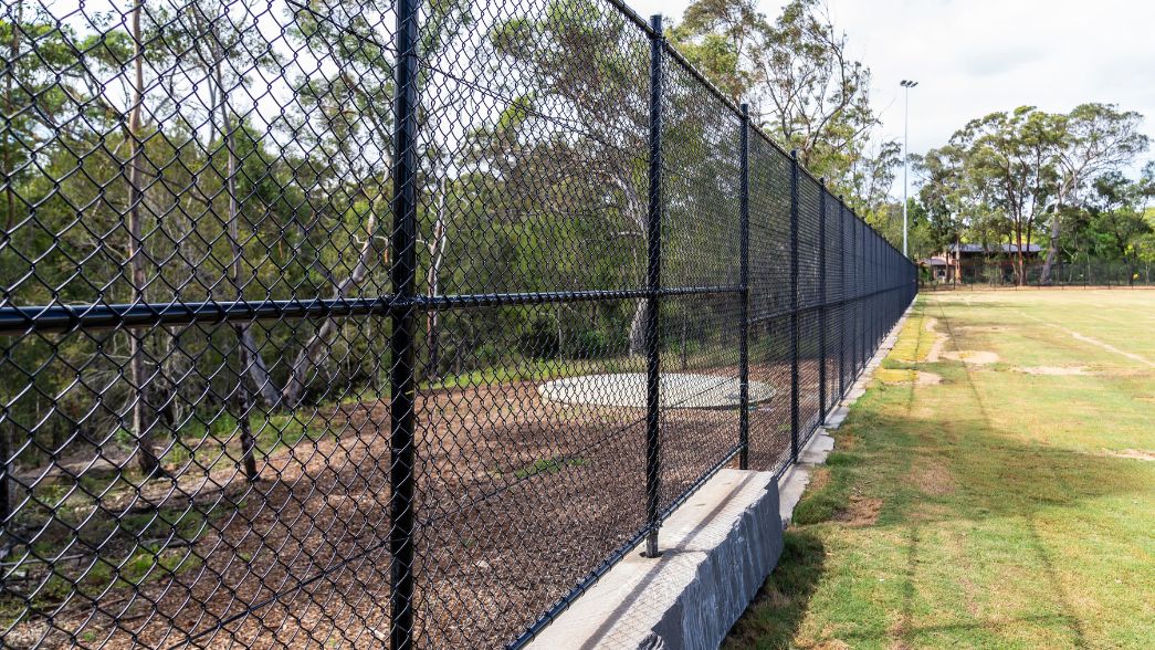 Fencing around sports oval in Kenthurst Park