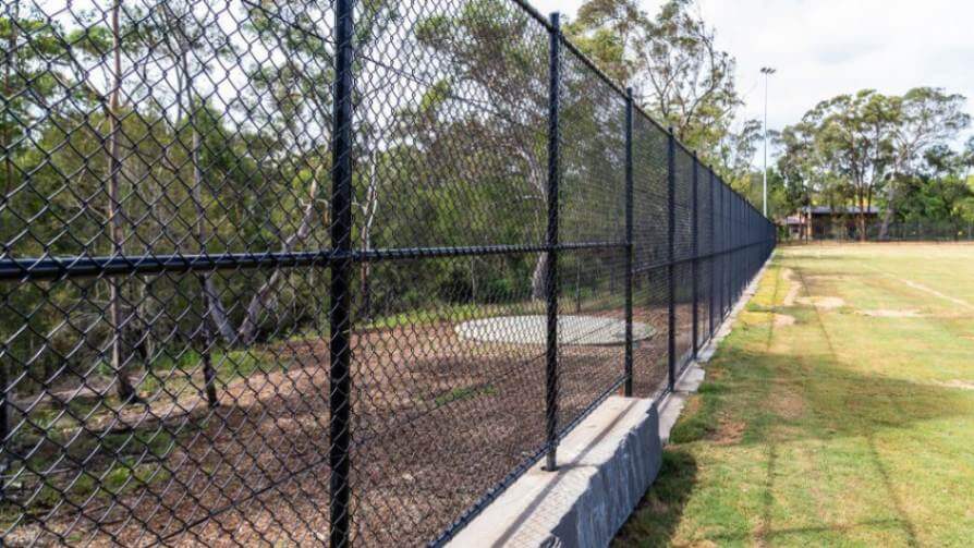 Fencing around sports oval in Kenthurst Park